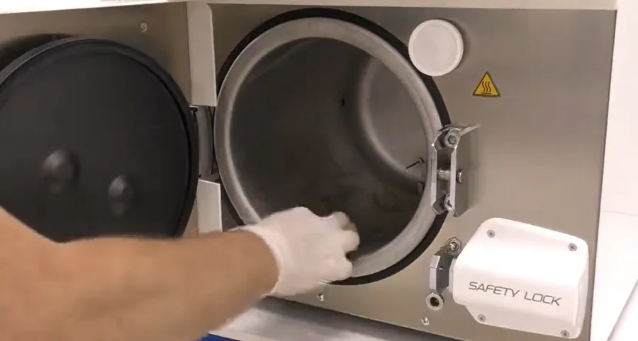 Autoclave sterilizer chamber requiring periodic cleaning and maintenance