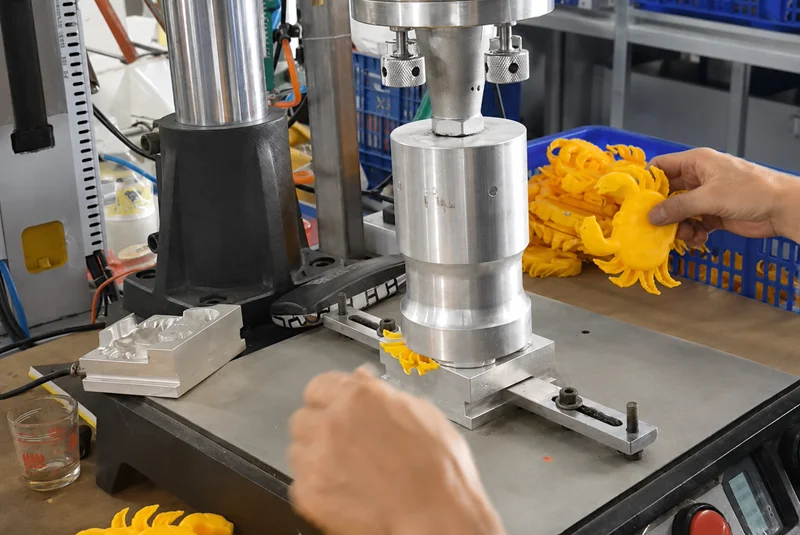 Ultrasonic welding horn contacting plastic toy components